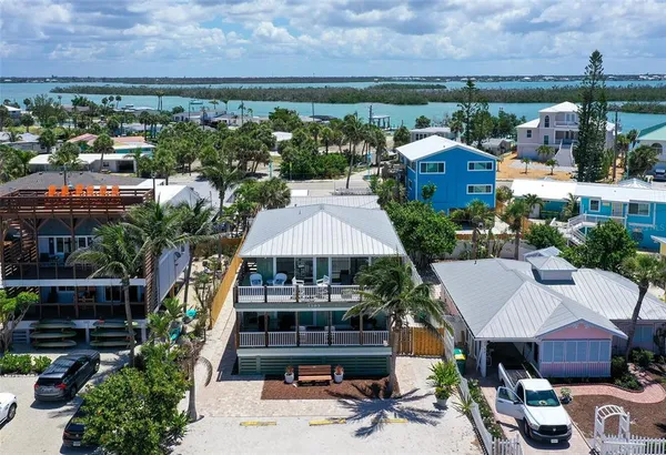 a aerial view of multiple houses with yard