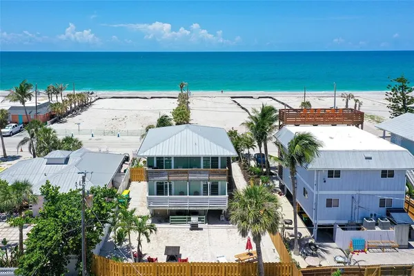 a aerial view of a house with a yard