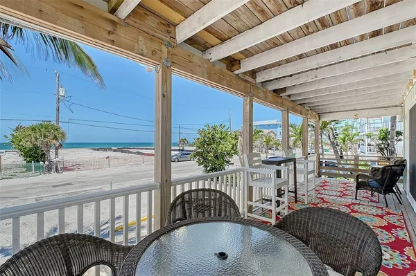 a view of a porch with furniture