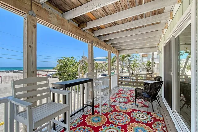 a view of balcony with wooden floor