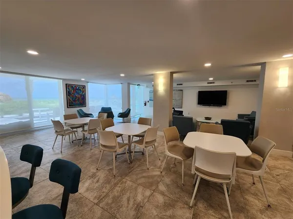 a large kitchen with a large window and stainless steel appliances