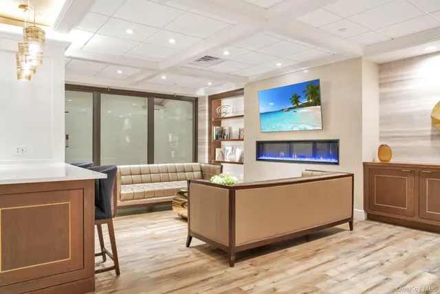 a view of a dining room with furniture wooden floor and a chandelier