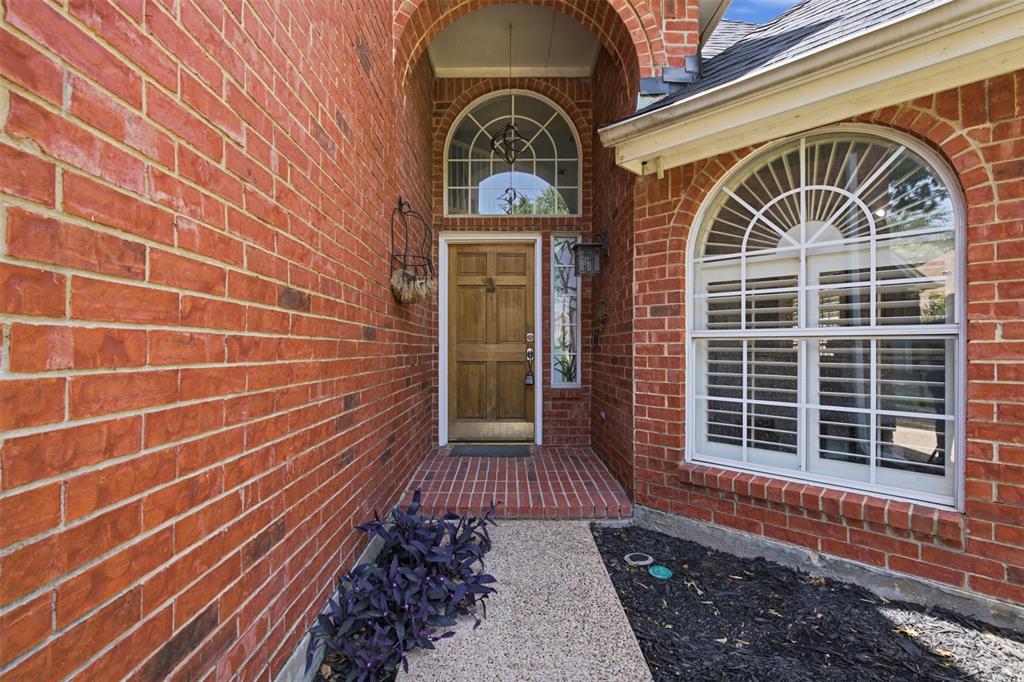 14584 Blueberry Court Addison, TX 75001 - Photo 2 of 40 a view of a door with brick walls