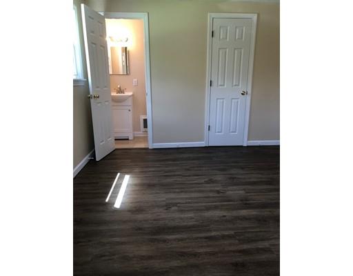 198 Treetop Avenue Springfield, MA 01118 - Photo 17 of 26 a view of a hallway with wooden floor