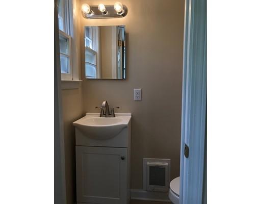 198 Treetop Avenue Springfield, MA 01118 - Photo 19 of 26 a bathroom with a sink a toilet and mirror