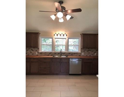 198 Treetop Avenue Springfield, MA 01118 - Photo 3 of 26 a large kitchen with granite countertop a stove a sink and dishwasher