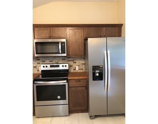 198 Treetop Avenue Springfield, MA 01118 - Photo 9 of 26 a kitchen with cabinets and stainless steel appliances