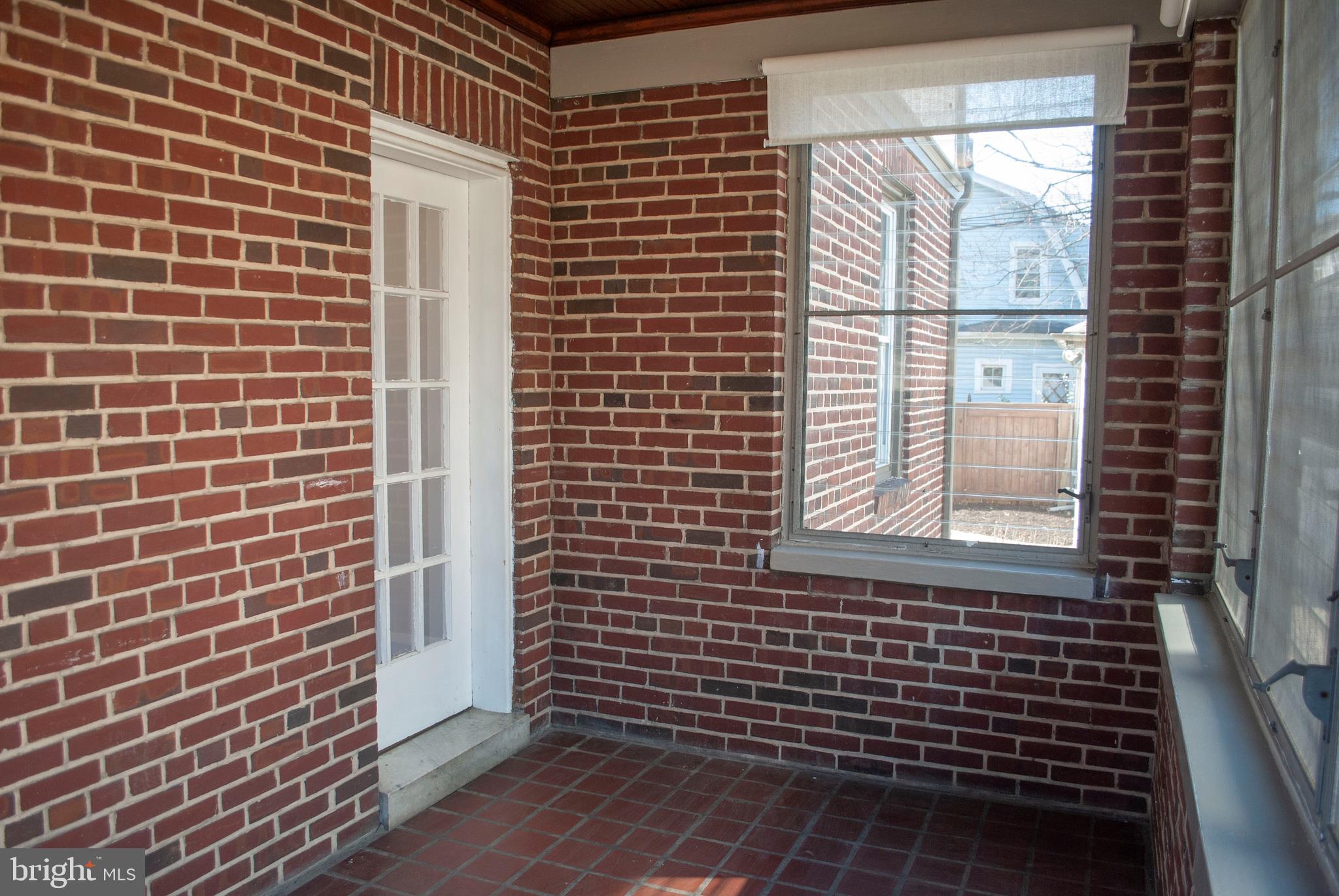 416 Westgate Road Baltimore, MD 21229 - Photo 9 of 44 Brick Walls in Sunroom