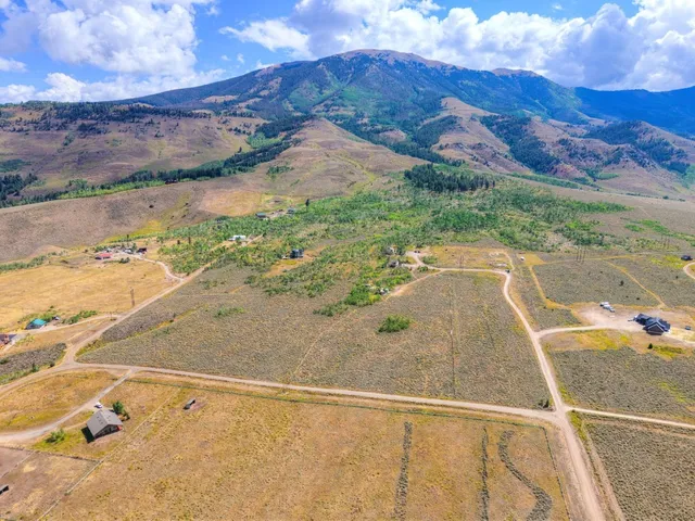 a room with furniture pool table and windows