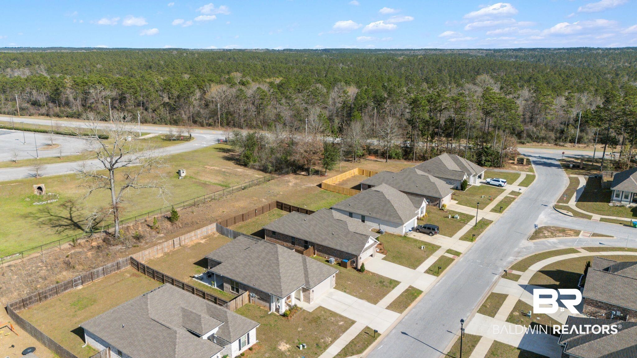 10745 Brodick Loop Daphne, AL 36527 - Photo 30 of 39 Aerial view of residential area with a forest