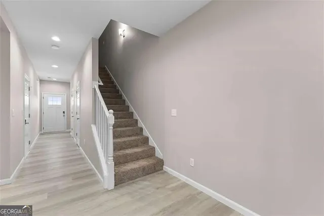 a view of a hallway with staircase