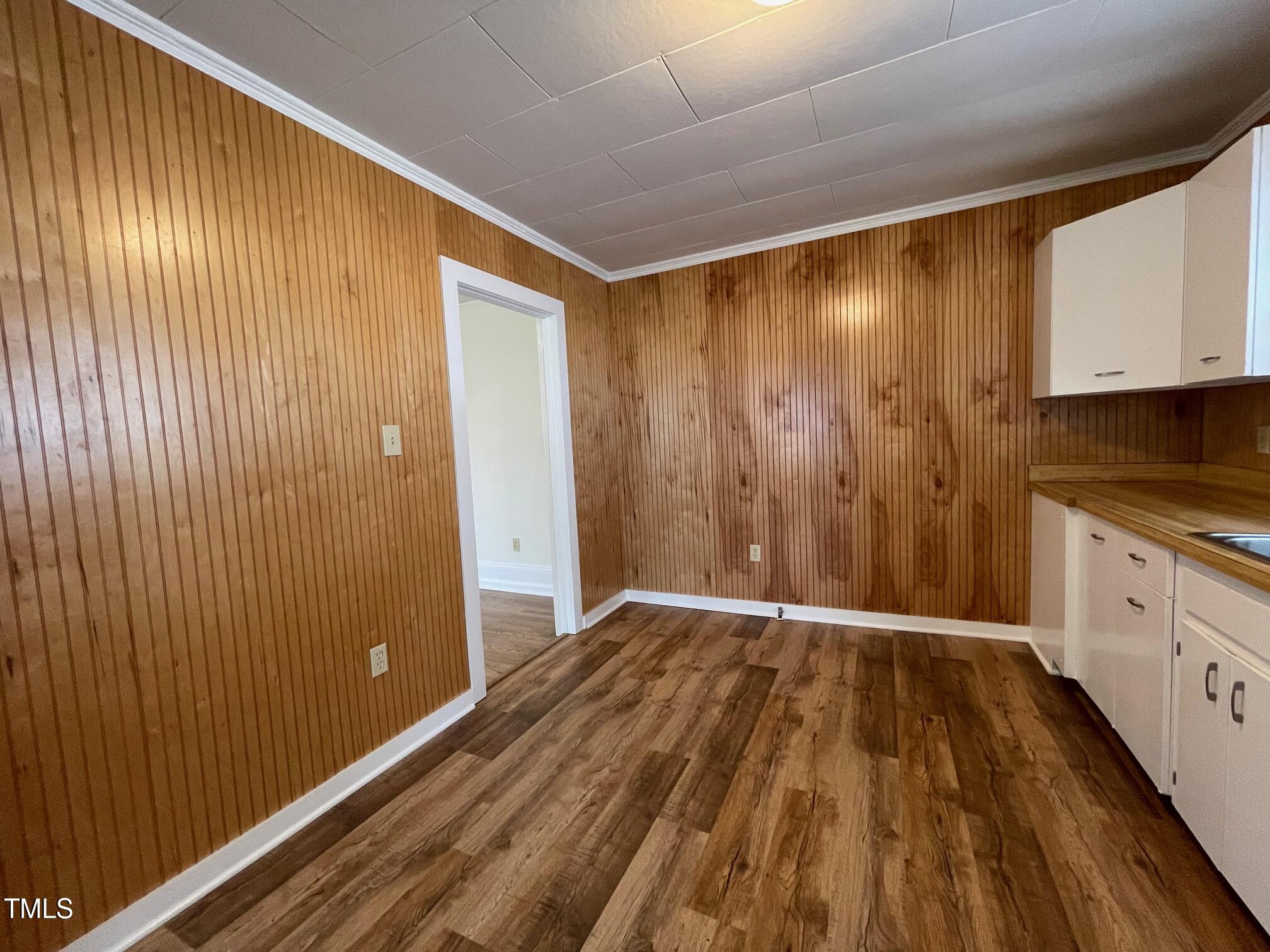 140 South Dunn Street Angier, NC 27501 - Photo 9 of 27 a view of a hallway with wooden floor