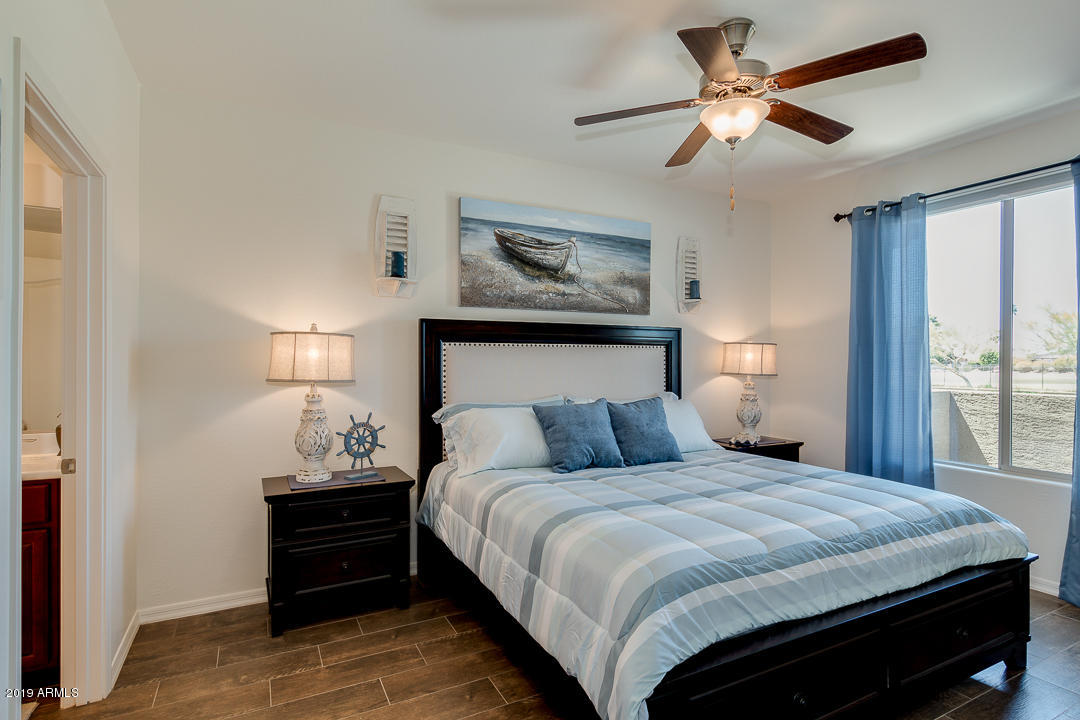 7726 East Baseline Road, Unit 143 Mesa, AZ 85209 - Photo 12 of 27 a bedroom with a bed and a window