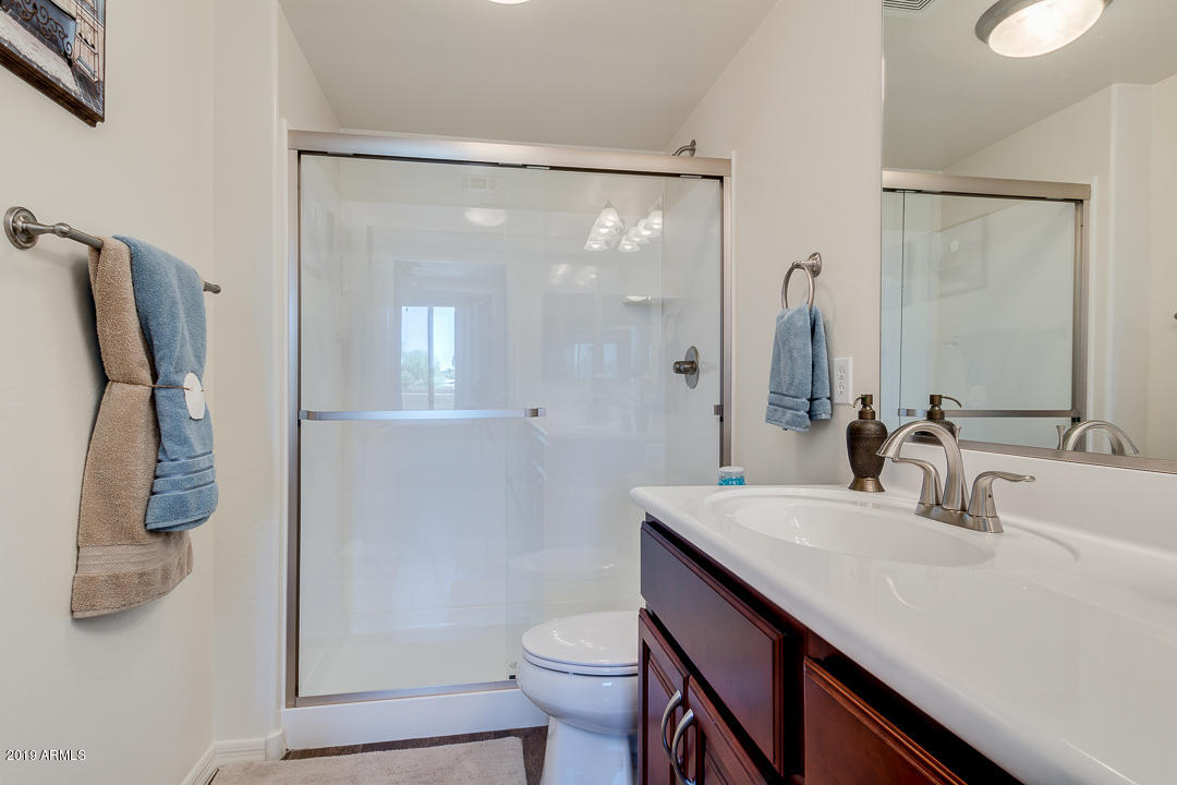 7726 East Baseline Road, Unit 143 Mesa, AZ 85209 - Photo 16 of 27 a bathroom with a sink a toilet and shower