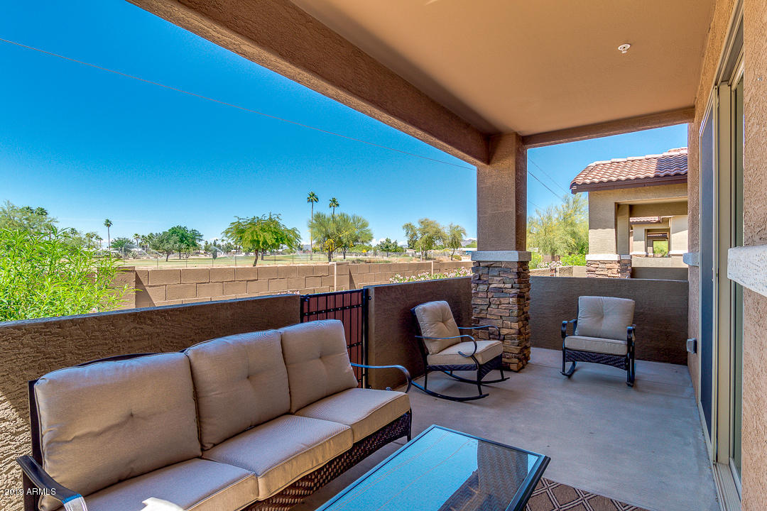 7726 East Baseline Road, Unit 143 Mesa, AZ 85209 - Photo 23 of 27 a roof deck with couches and potted plants