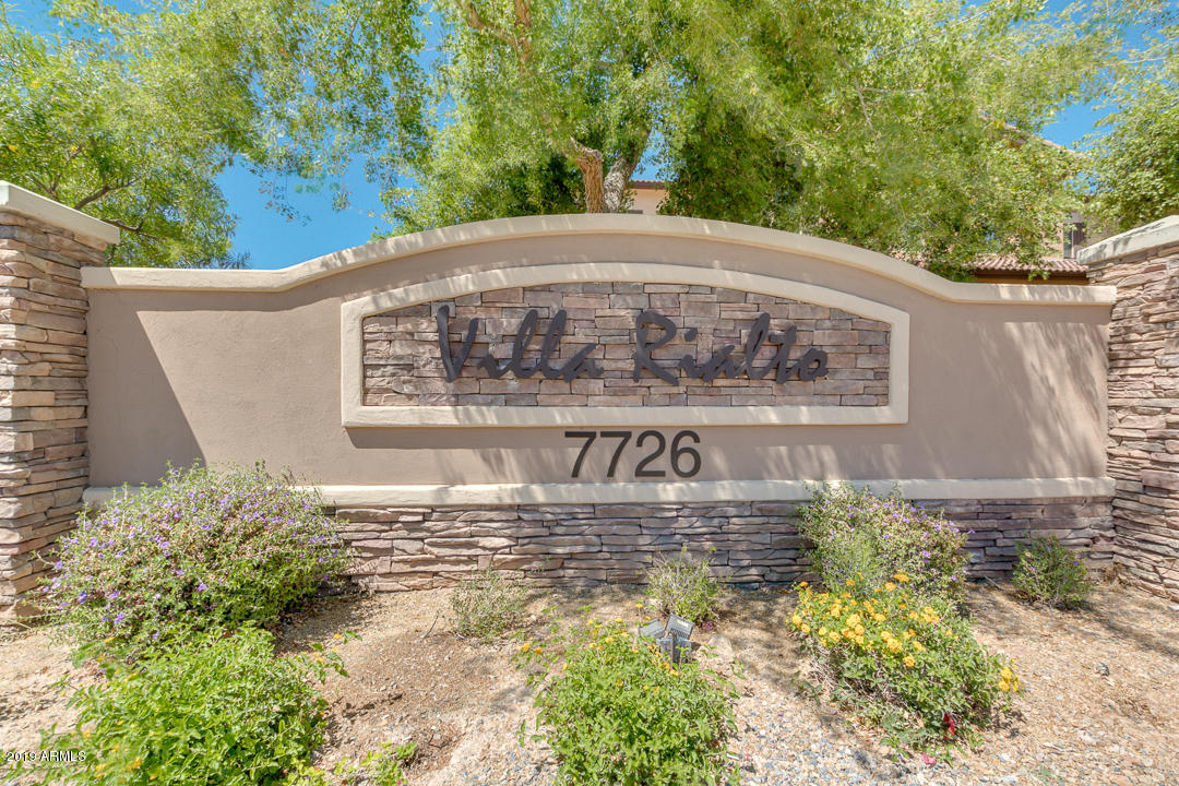 7726 East Baseline Road, Unit 143 Mesa, AZ 85209 - Photo 27 of 27 a sign that is on a brick wall