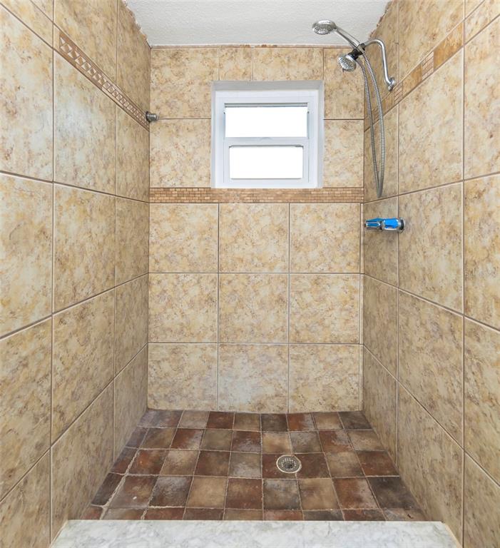 3105 Pinon Drive Holiday, FL 34691 - Photo 17 of 23 a bathroom with a shower