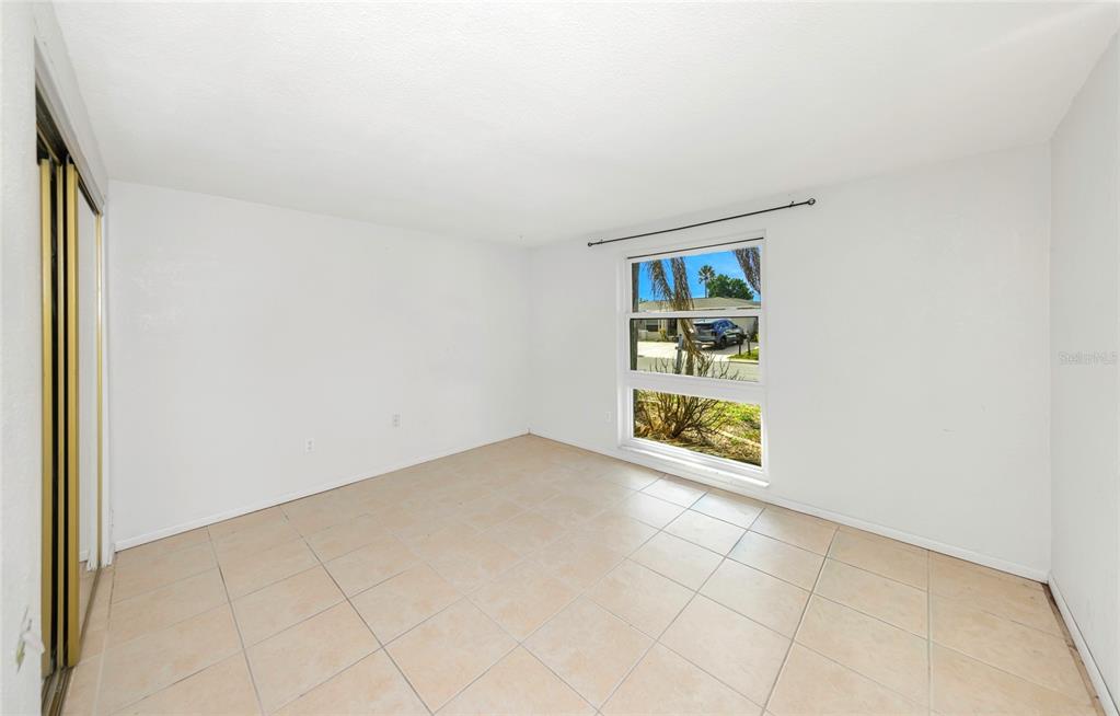 3105 Pinon Drive Holiday, FL 34691 - Photo 18 of 23 an empty room with windows
