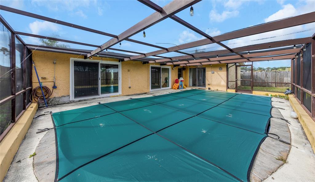 3105 Pinon Drive Holiday, FL 34691 - Photo 2 of 23 a view of a couches in the patio