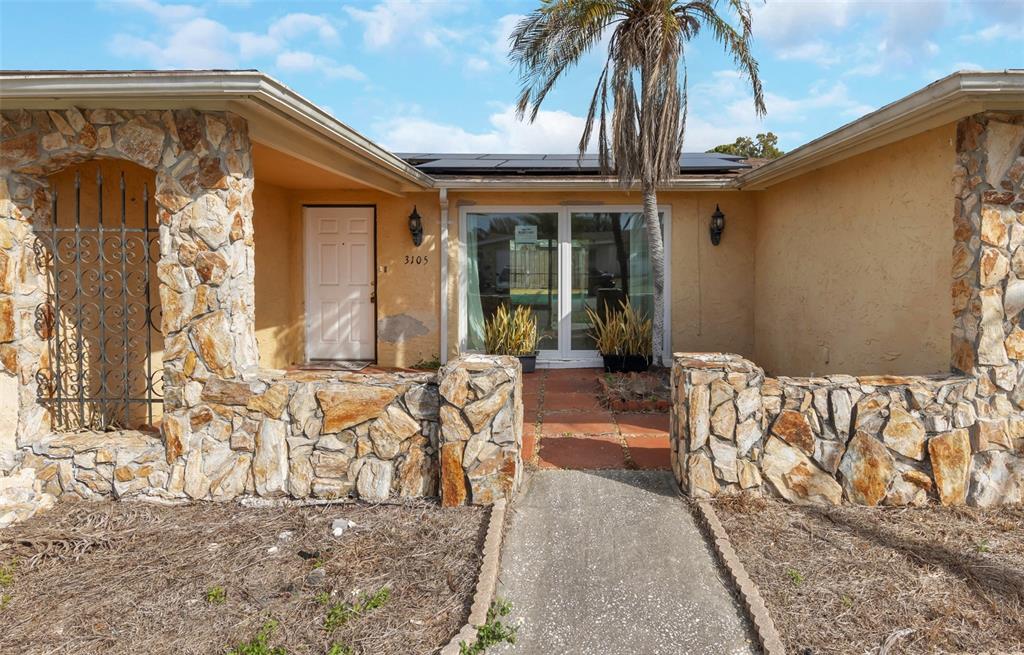 3105 Pinon Drive Holiday, FL 34691 - Photo 3 of 23 a front view of a house