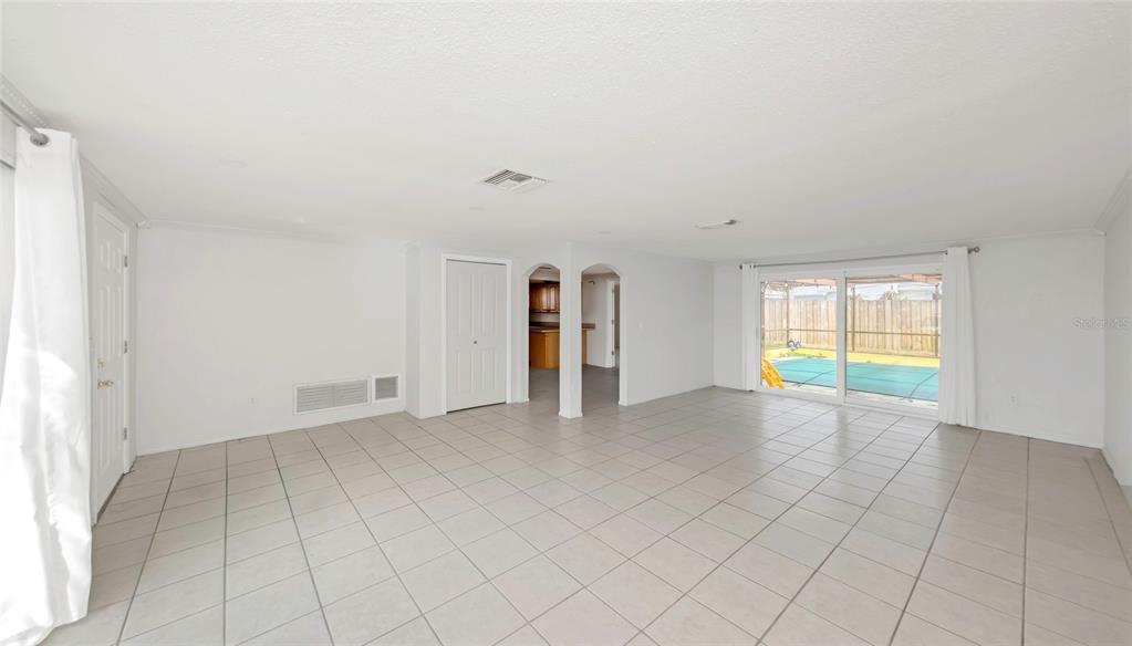 3105 Pinon Drive Holiday, FL 34691 - Photo 4 of 23 a view of an empty room with a window
