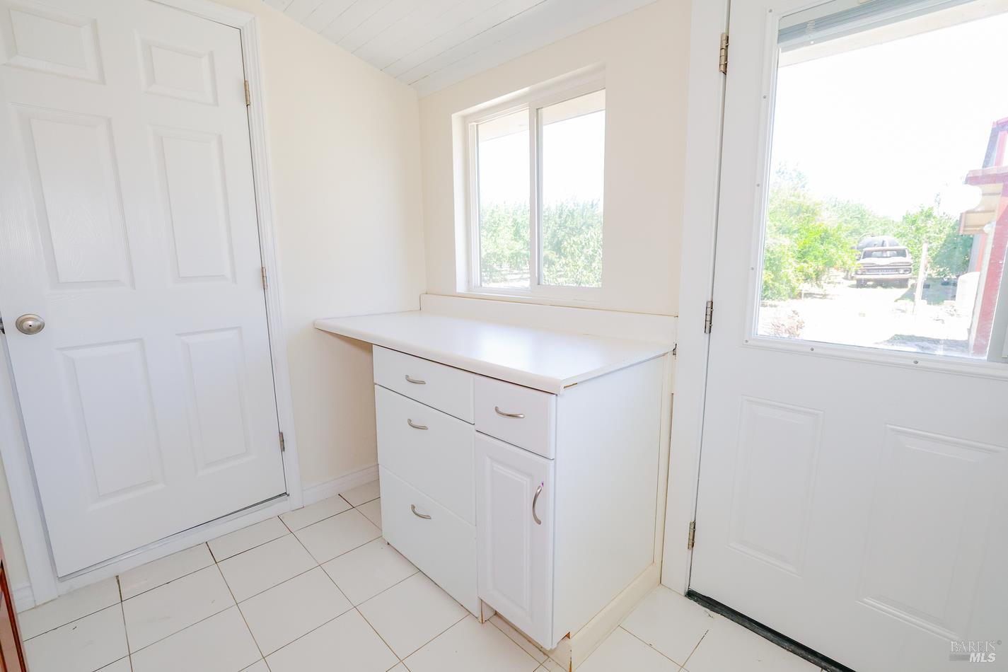 7948 North Meridian Road Dixon, CA 95620 - Photo 31 of 59 a view of a kitchen with white cabinets