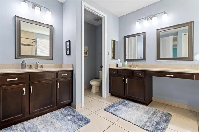 a view of a patio with a dining table and chairs