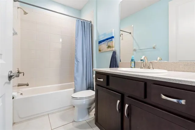 an aerial view of a house with a yard and potted plants