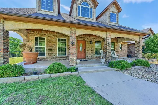 front view of a house with a small yard
