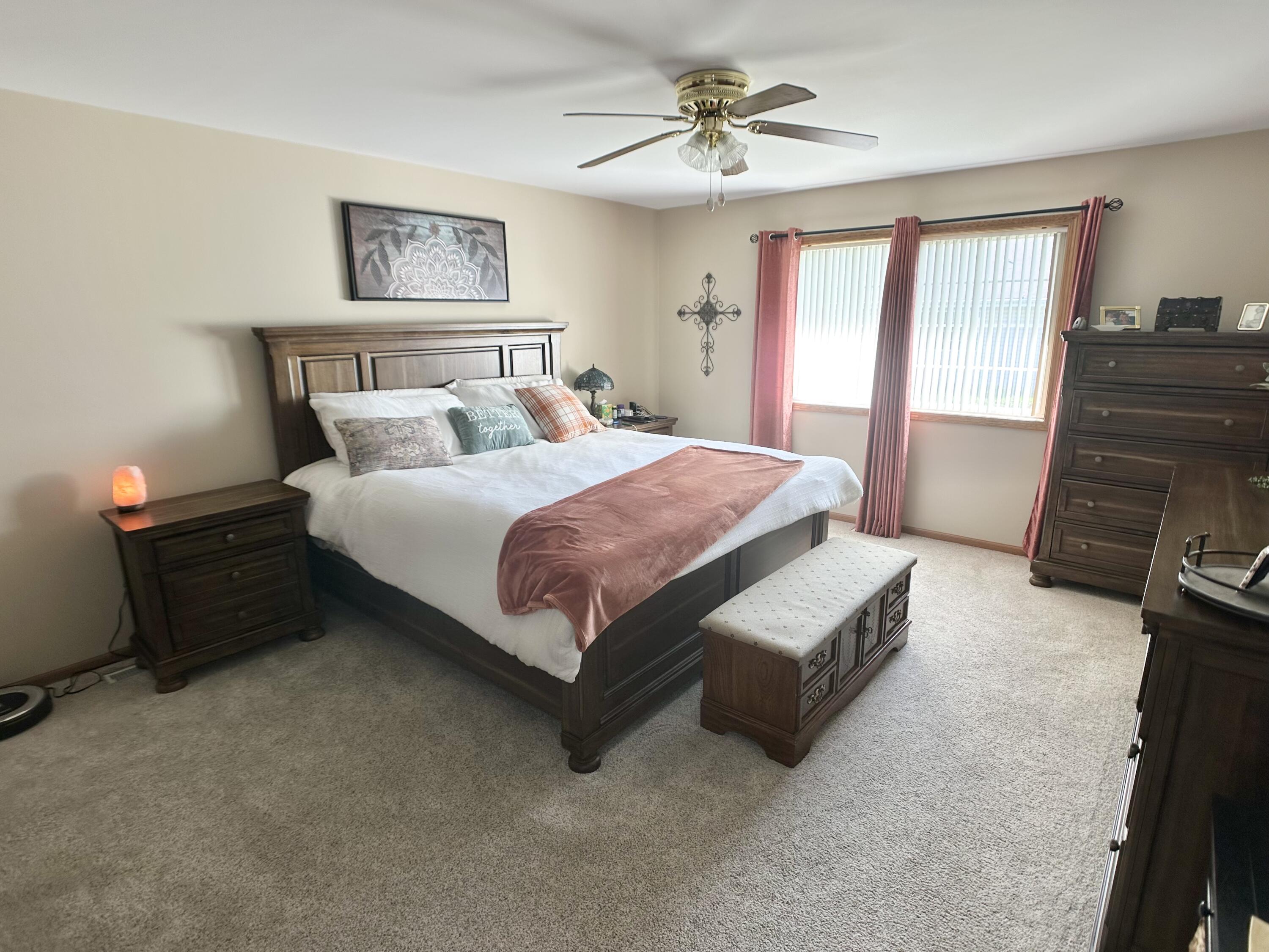 9748 Erie Street Highland, IN 46322 - Photo 6 of 14 a spacious bedroom with a bed and a walk in closet