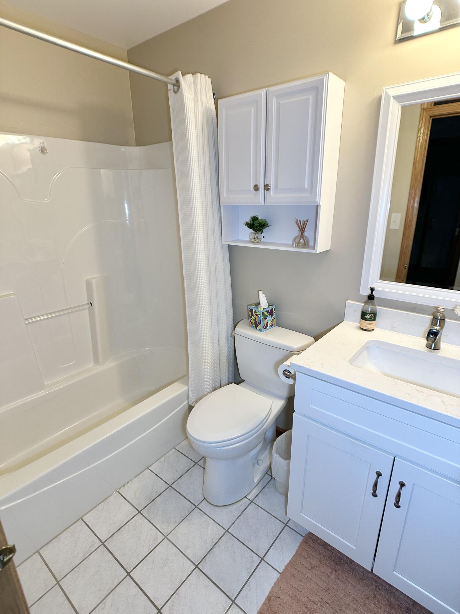 9748 Erie Street Highland, IN 46322 - Photo 10 of 14 a bathroom with a sink toilet and shower