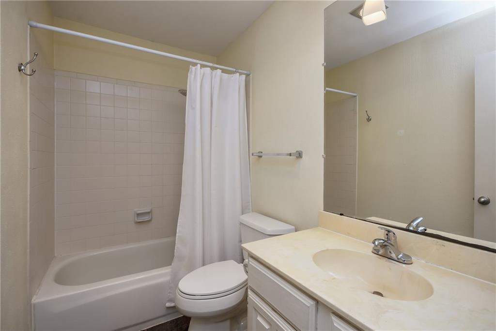 8210 Bent Tree Road, Unit 144 Austin, TX 78759 - Photo 14 of 24 a bathroom with a sink toilet and shower