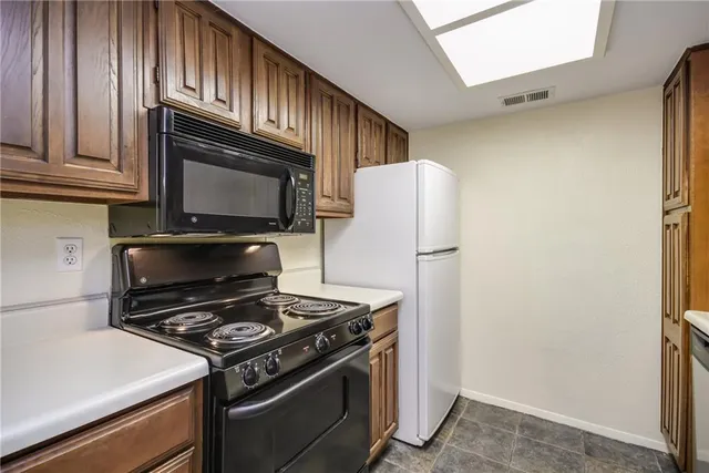 a kitchen with a stove microwave and refrigerator