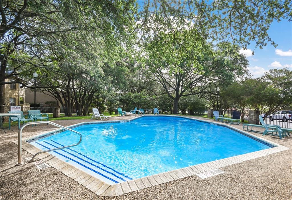 8210 Bent Tree Road, Unit 144 Austin, TX 78759 - Photo 22 of 24 a view of a swimming pool with an outdoor space