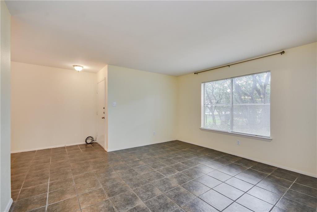 8210 Bent Tree Road, Unit 144 Austin, TX 78759 - Photo 9 of 24 a view of an empty room with a window