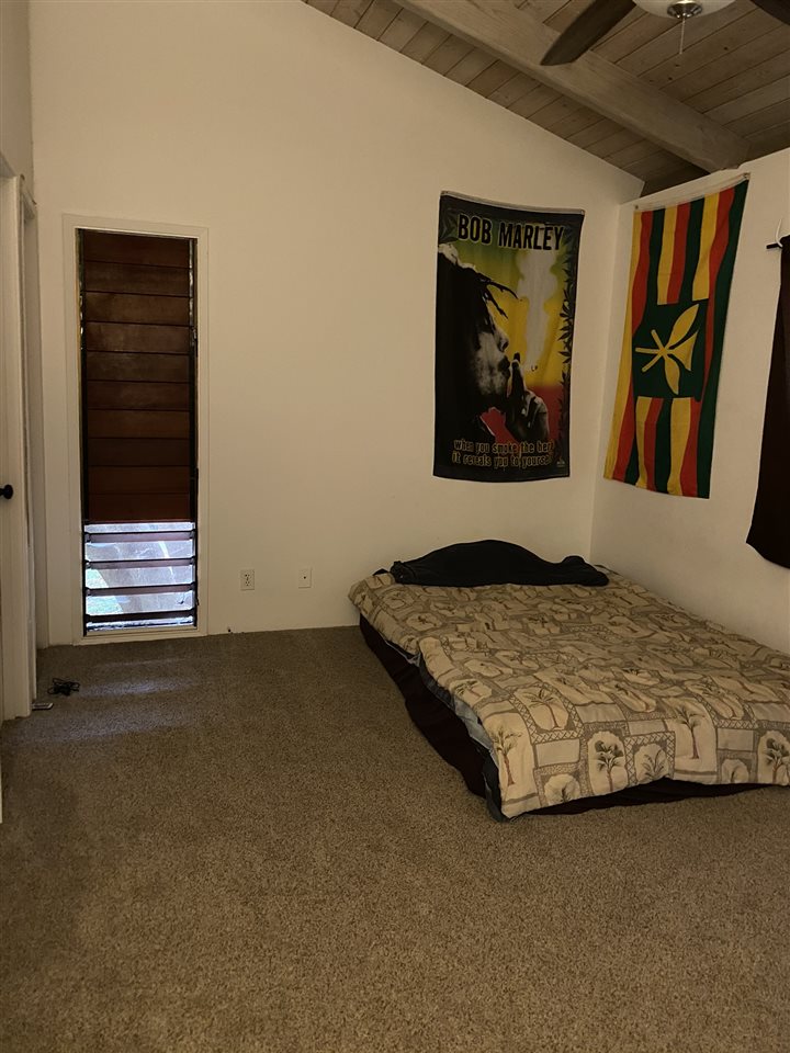 51 Kulalani Circle Kula, HI 96790 - Photo 12 of 30 a bedroom with a bed and wall painting