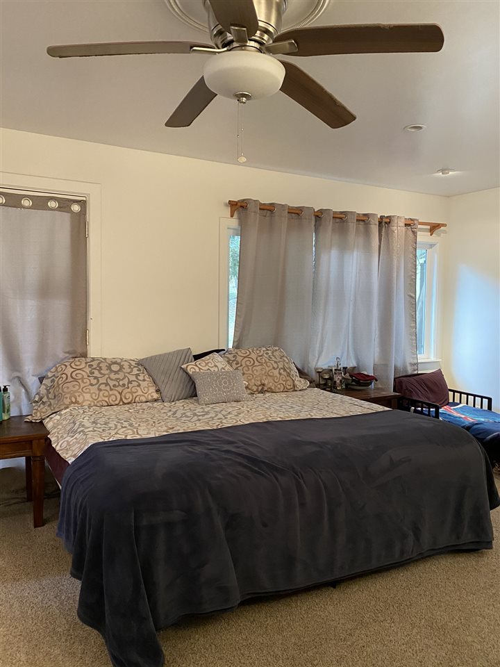 51 Kulalani Circle Kula, HI 96790 - Photo 17 of 30 a bedroom with a bed and ceiling fan