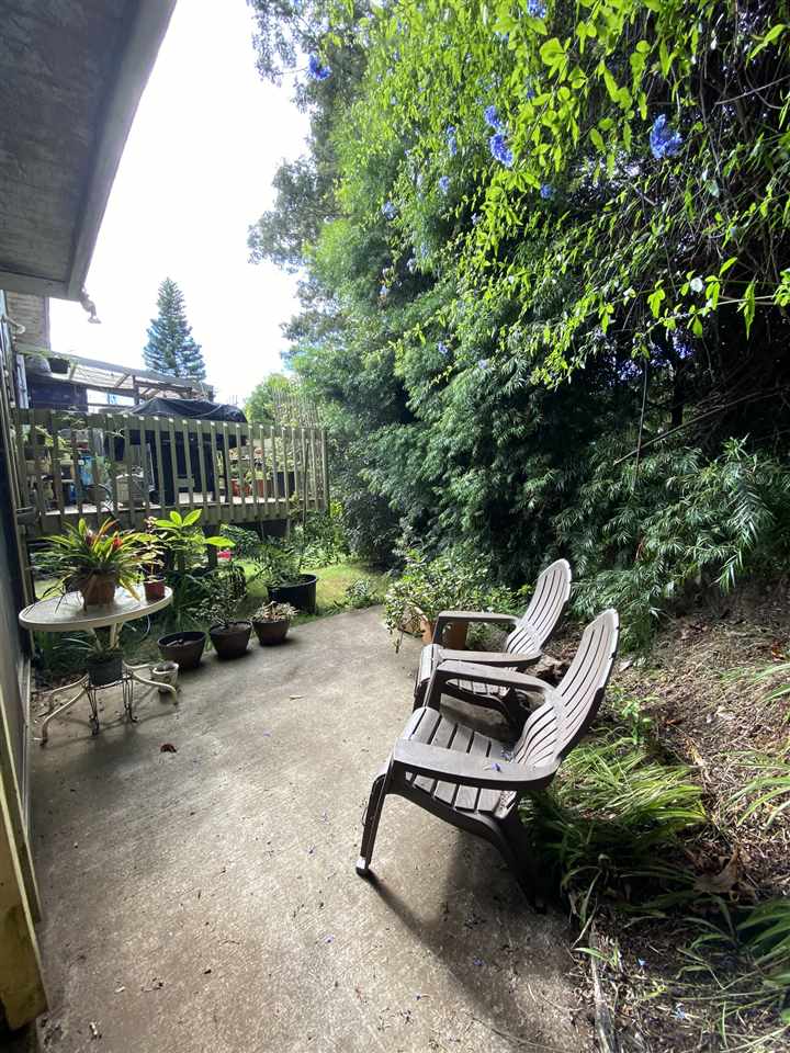 51 Kulalani Circle Kula, HI 96790 - Photo 21 of 30 a backyard of a house with barbeque oven and outdoor seating