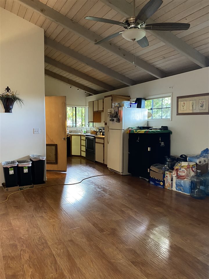 51 Kulalani Circle Kula, HI 96790 - Photo 7 of 30 a kitchen with a refrigerator and a stove top oven