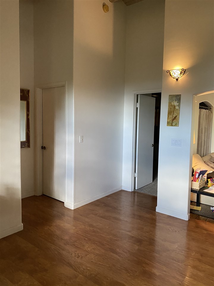 51 Kulalani Circle Kula, HI 96790 - Photo 9 of 30 an empty room with wooden floor and windows