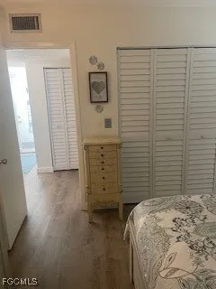 a bedroom with a bed and a desk