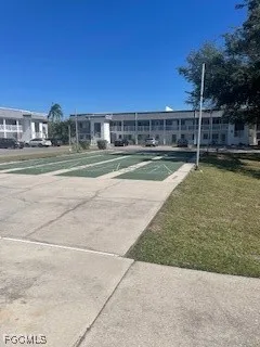 a view of yard with swimming pool and seating