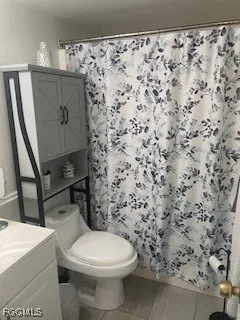 a bathroom with a toilet and a sink