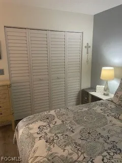 a bedroom with a bed and a lamp