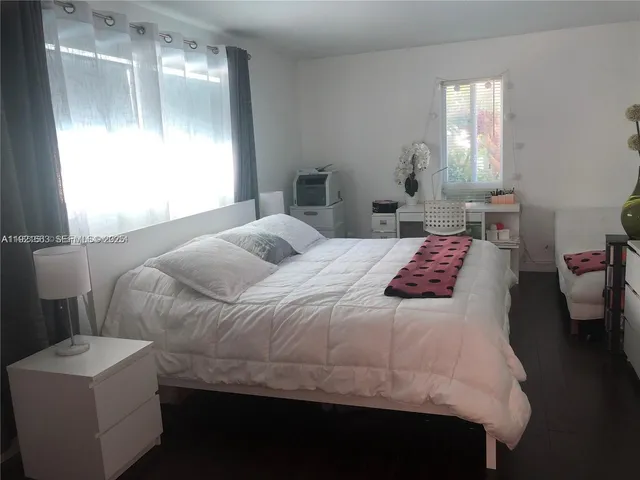 a bathroom with a sink a mirror and vanity