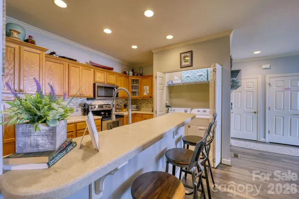 a dining room with furniture and wooden floor