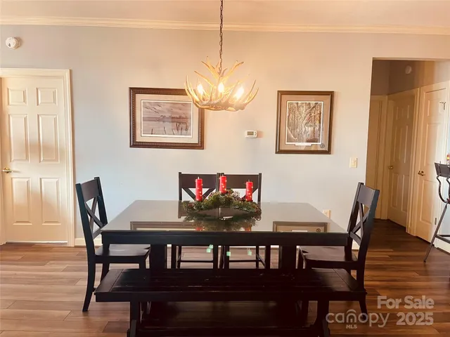 a view of a room with furniture and wooden floor
