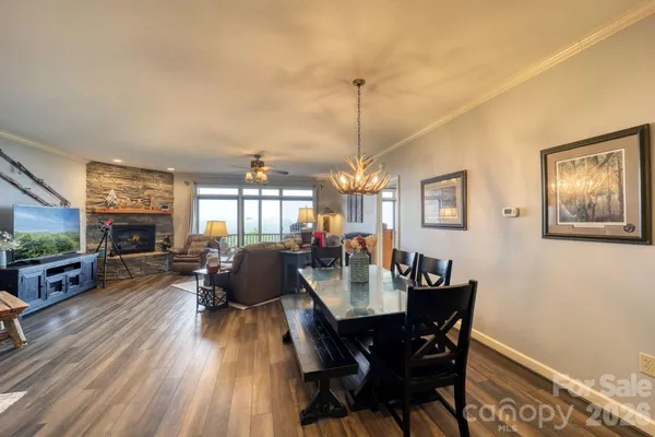 a spacious bathroom with a tub a sink and a large mirror