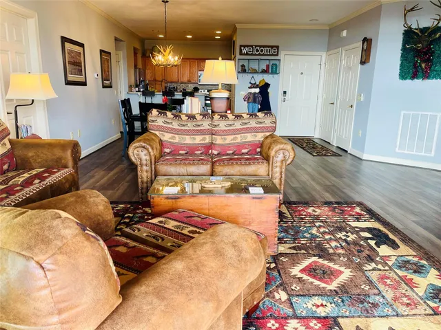a bedroom with a bed a flat screen tv and a large window with the garden view