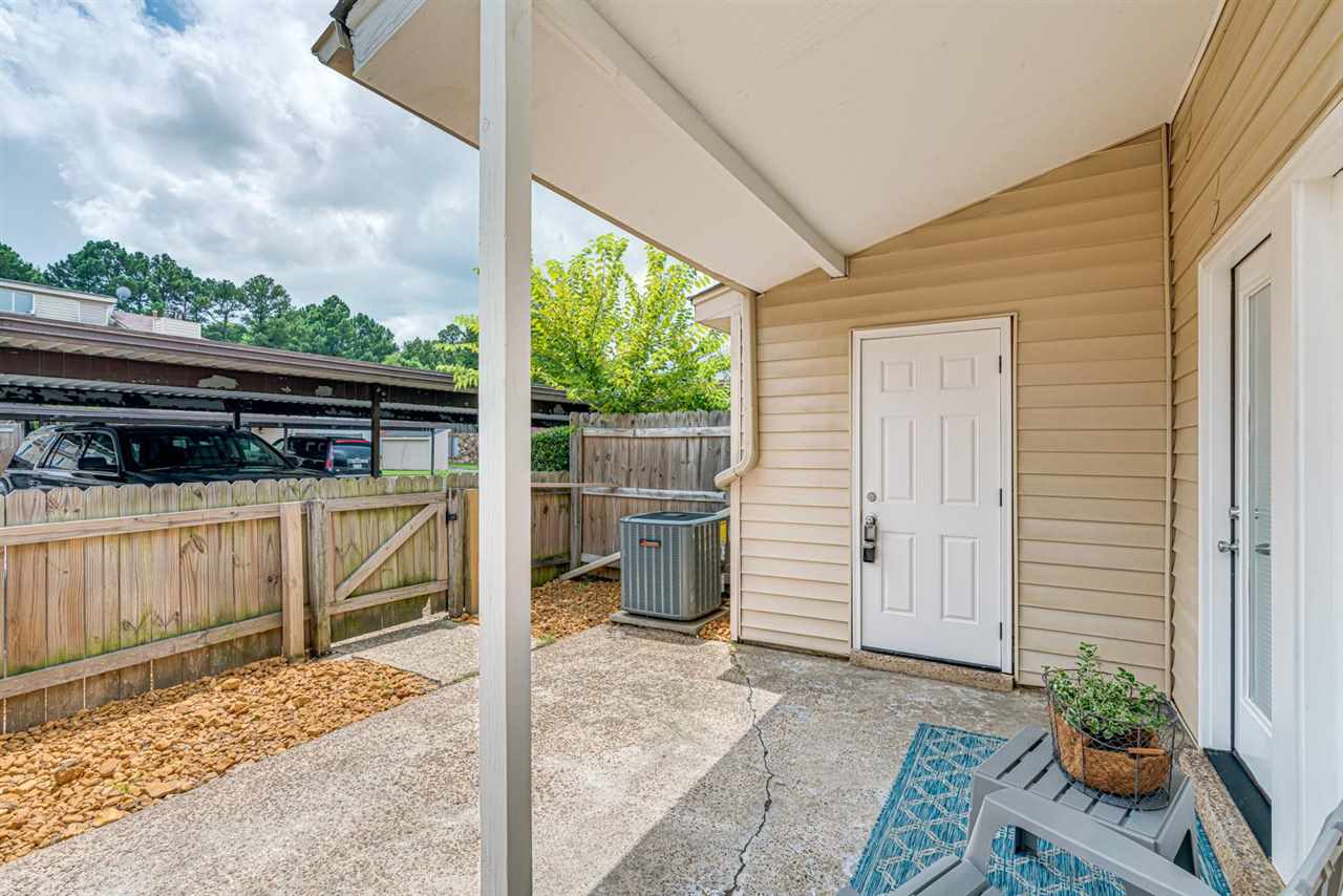 5565 Pleasant View Road, Unit 5565 Memphis, TN 38134 - Photo 20 of 25 a view of a patio with table and chairs and potted plants